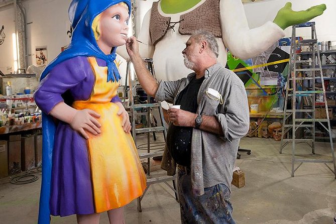 New Orleans Mardi Gras World Behind-the-Scenes Tour - Costumes, photos, and King Cake